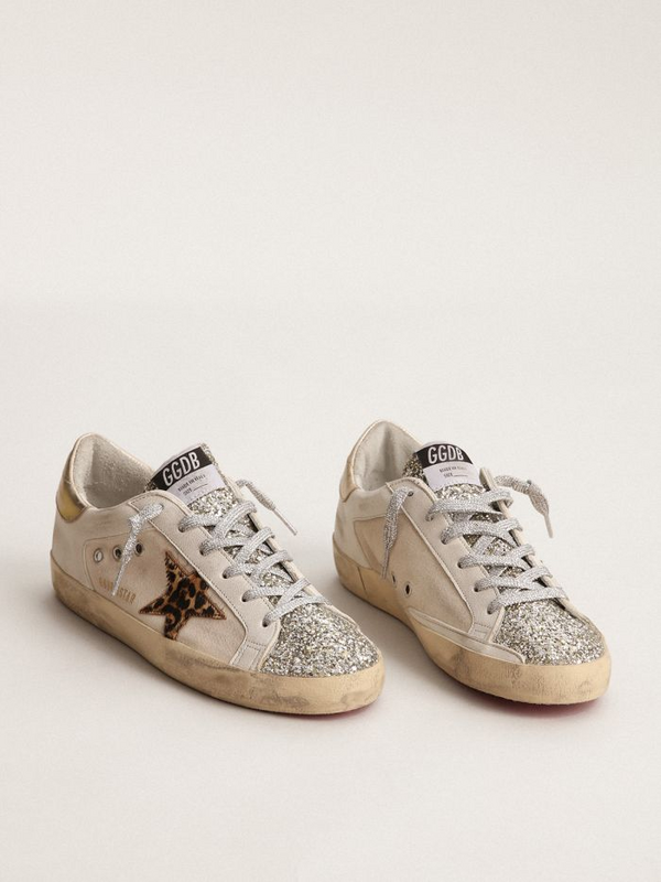 golden goose Super-Star sneakers with platinum-colored glitter tongue and leopard-print pony