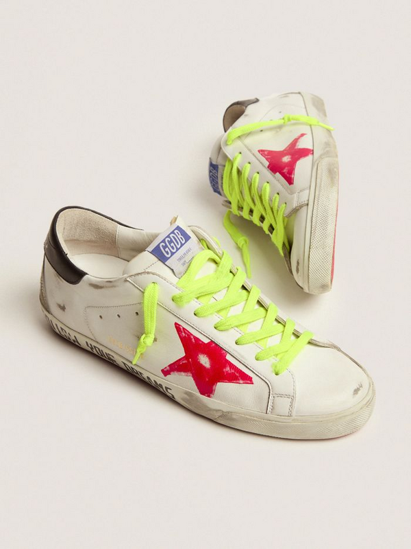 golden goose Super-Star sneakers with red screen printed star and handwritten lettering on th